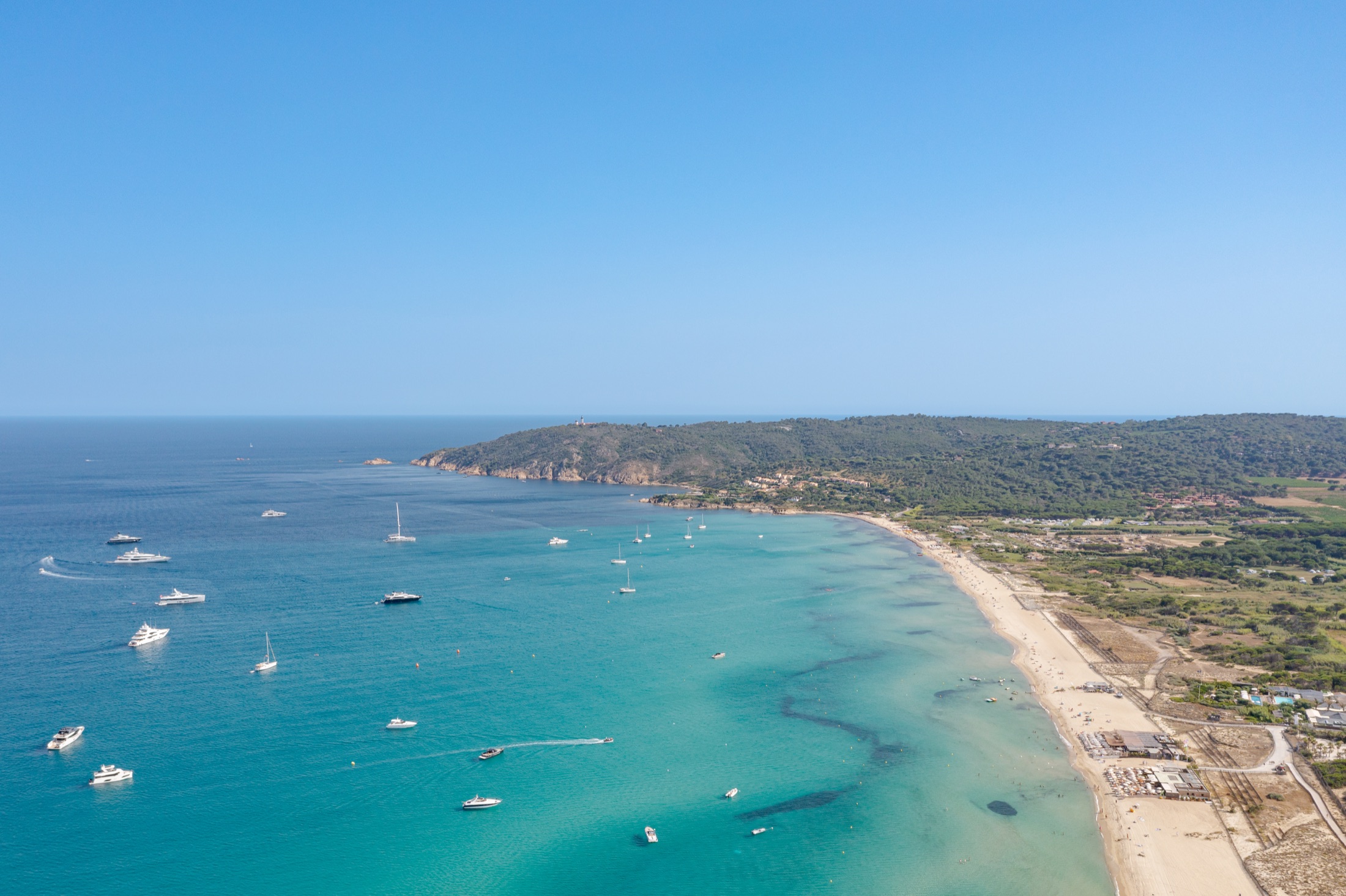 Yachts anchored in the blue Mediterranean beside Pampelonne Beach