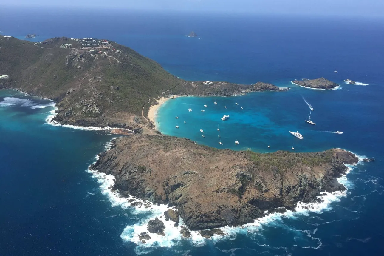 Aerial view of yachts anchored in Colombier Bay